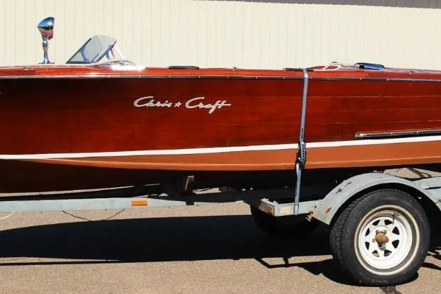Slide: The Image of 1948 Chris-Craft 35 Double Cabin boat on trailer, showcasing classic wooden design. - 5
