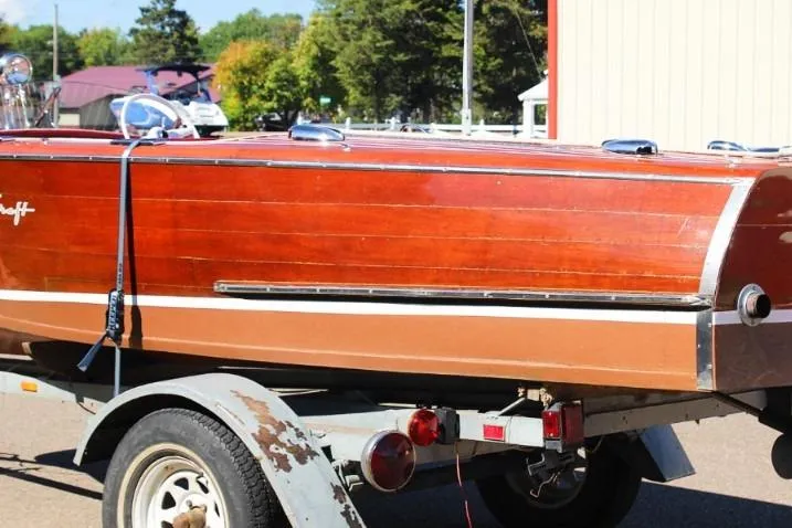 Slide: The Image of 1948 Chris-Craft 35 Double Cabin boat on trailer, showcasing classic wooden design. - 6