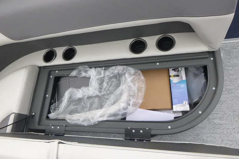 Slide: The Image of 2026 Sun Tracker Bass Buggy 16 XL Select boat seat with cup holders, gray and white design. - 13