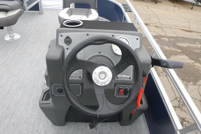 Slide: The Image of 2026 Sun Tracker Bass Buggy 16 XL Select pontoon boat interior with seating and steering console. - 8
