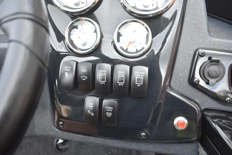 Slide: The Image of Control panel of 2026 Tracker Targa V-19 WT boat with switches and gauges. - 100