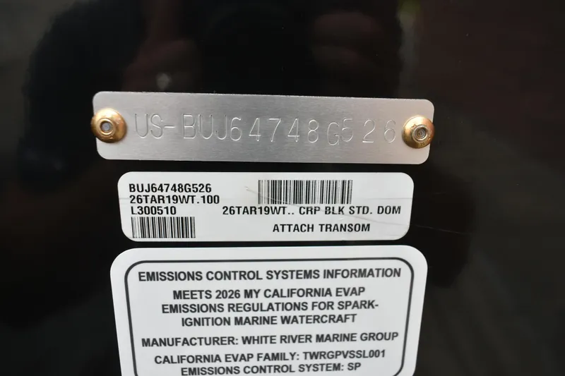 Slide: The Image of 2026 Tracker Targa V-19 WT emissions control label with serial number and compliance details. - 104