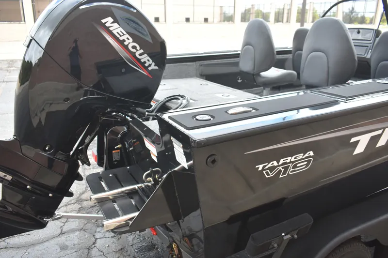 Slide: The Image of 2026 Tracker Targa V-19 WT boat with Mercury outboard motor, interior seating visible. - 85