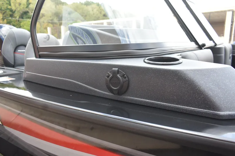Slide: The Image of 2026 Tracker Targa V-19 WT boat interior with windshield and cup holder detail. - 90