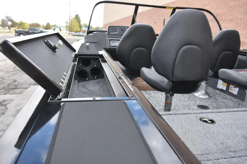 Slide: The Image of 2026 Tracker Targa V-19 WT boat interior with open storage compartment and seating. - 94