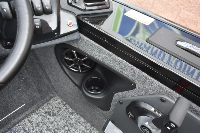 Slide: The Image of 2026 Tracker Targa V-19 WT boat interior with speaker, cup holder, and control panel. - 99