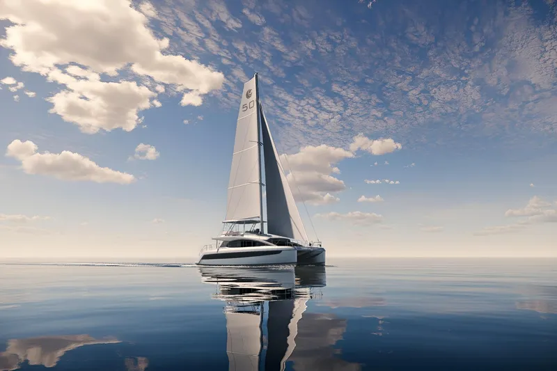 The Image of Sleek 2026 Aquila 50 Sail catamaran gliding on calm ocean under a clear sky. - 1