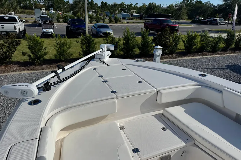 Slide: The Image of 2023 Robalo 266 Cayman boat deck with trolling motor, parked in a lot. - 10