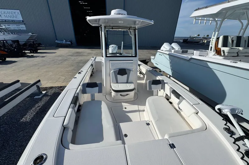 Slide: The Image of 2023 Robalo 266 Cayman boat with spacious deck and modern design. - 12
