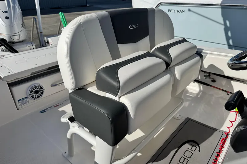 Slide: The Image of 2023 Robalo 266 Cayman boat seating with black and white upholstery. - 21