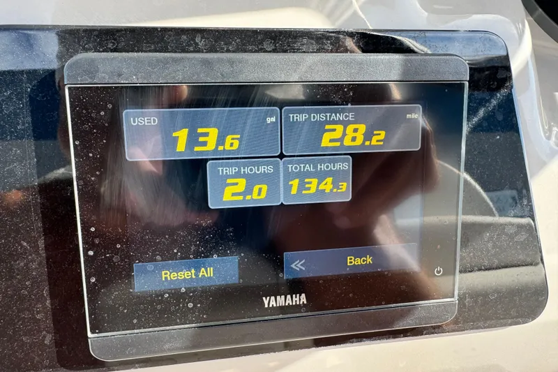 Slide: The Image of Display screen showing fuel usage and trip data on a 2023 Robalo 266 Cayman. - 30
