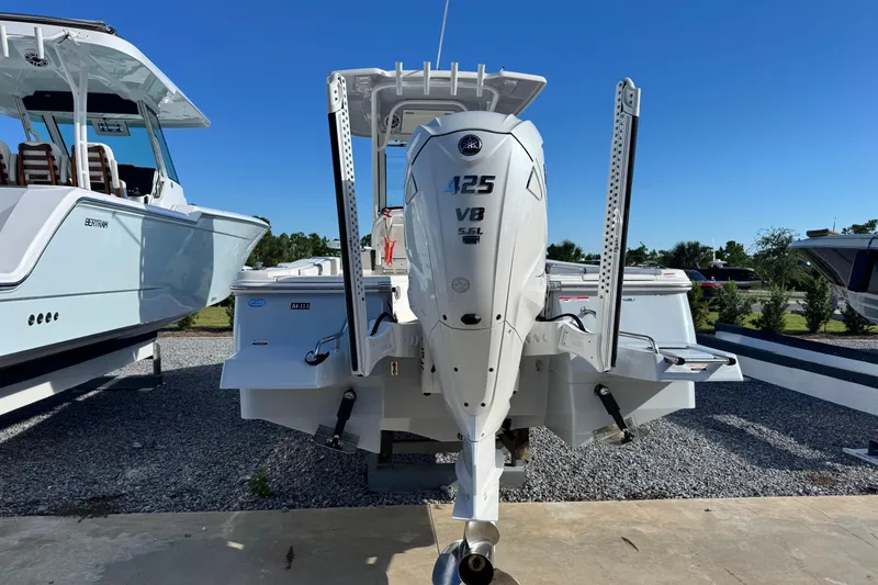 Slide: The Image of 2023 Robalo 266 Cayman boat with powerful V8 engine, displayed outdoors. - 6