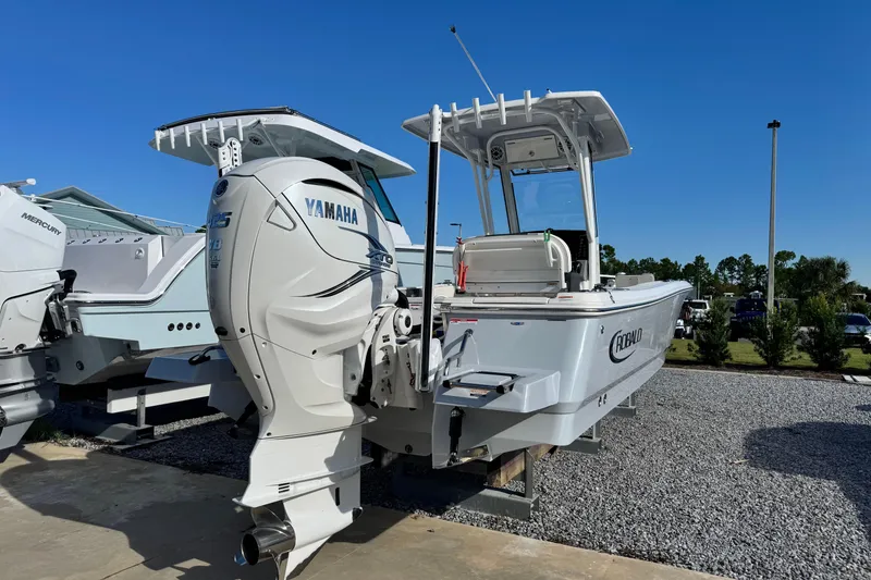 Slide: The Image of 2023 Robalo 266 Cayman boat with Yamaha engine, displayed outdoors on a sunny day. - 7