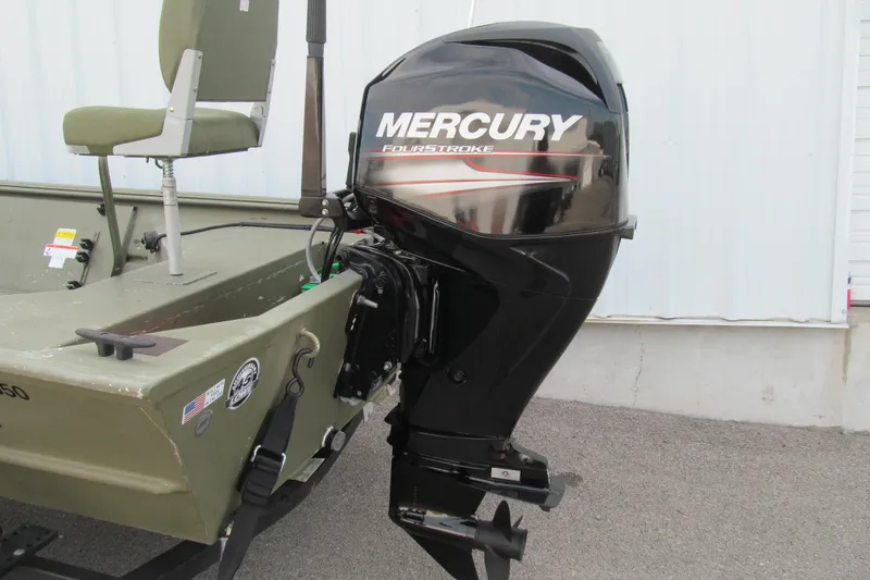 Slide: The Image of 2016 Lowe Roughneck 1650 boat with Mercury FourStroke outboard motor, green seating, and decals. - 12