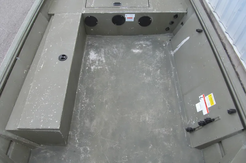 Slide: The Image of Interior of a 2016 Lowe Roughneck 1650 boat, showing spacious, durable deck. - 5