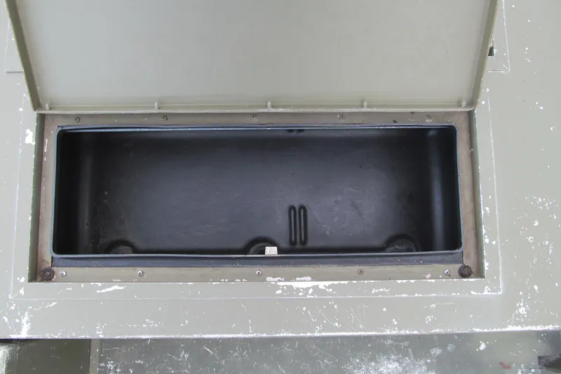 Slide: The Image of Open storage compartment on 2016 Lowe Roughneck 1650 boat. - 8