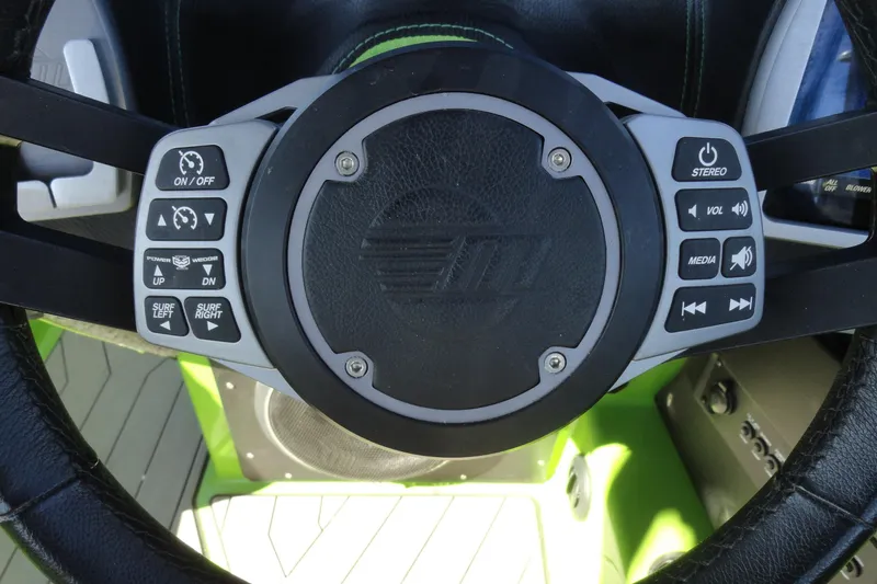 Slide: The Image of Steering wheel controls of a 2018 Malibu Wakesetter 24 MXZ boat. - 11