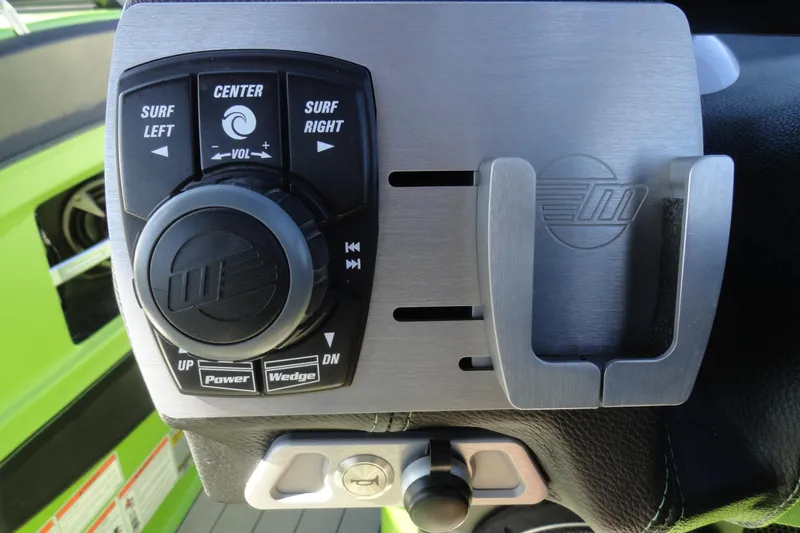 Slide: The Image of Control panel of 2018 Malibu Wakesetter 24 MXZ boat with surf and volume adjustments. - 13