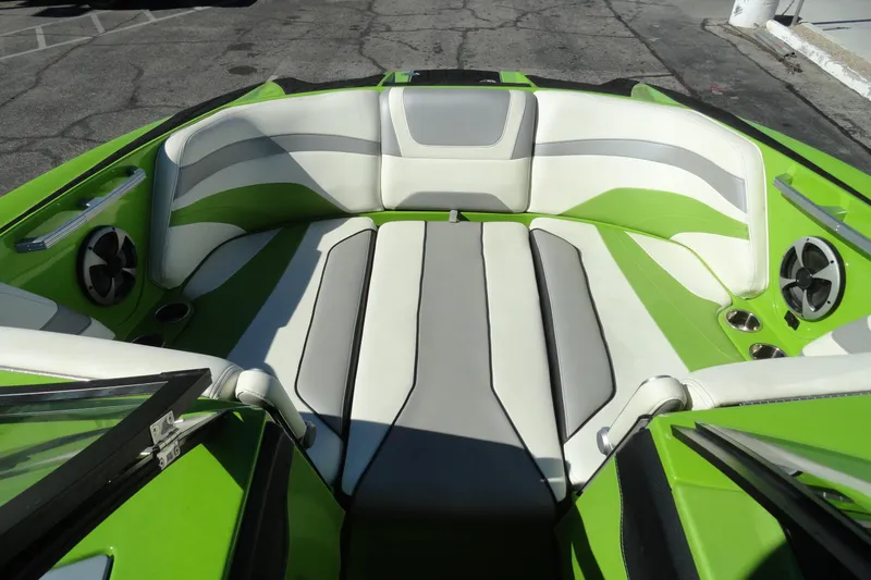 Slide: The Image of Interior of 2018 Malibu Wakesetter 24 MXZ boat with green and white seating. - 20