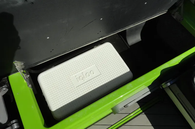 Slide: The Image of Storage compartment with Igloo cooler in 2018 Malibu Wakesetter 24 MXZ boat. - 26