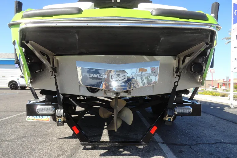 Slide: The Image of 2018 Malibu Wakesetter 24 MXZ boat rear view with propeller and Power Wedge feature. - 31