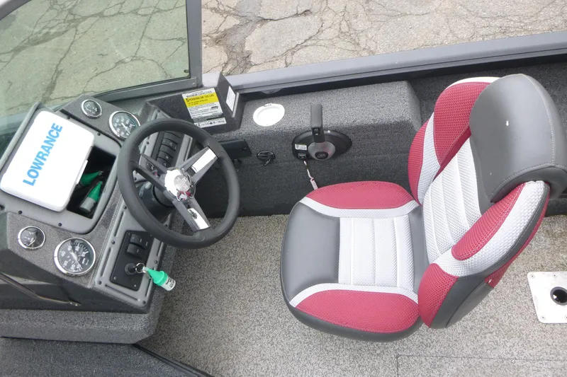 Slide: The Image of 2020 Ranger VS1682 WT boat cockpit with steering wheel and red-gray seat. - 10
