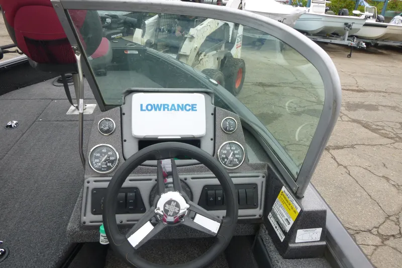 Slide: The Image of 2020 Ranger VS1682 WT boat dashboard with Lowrance display and steering wheel. - 11