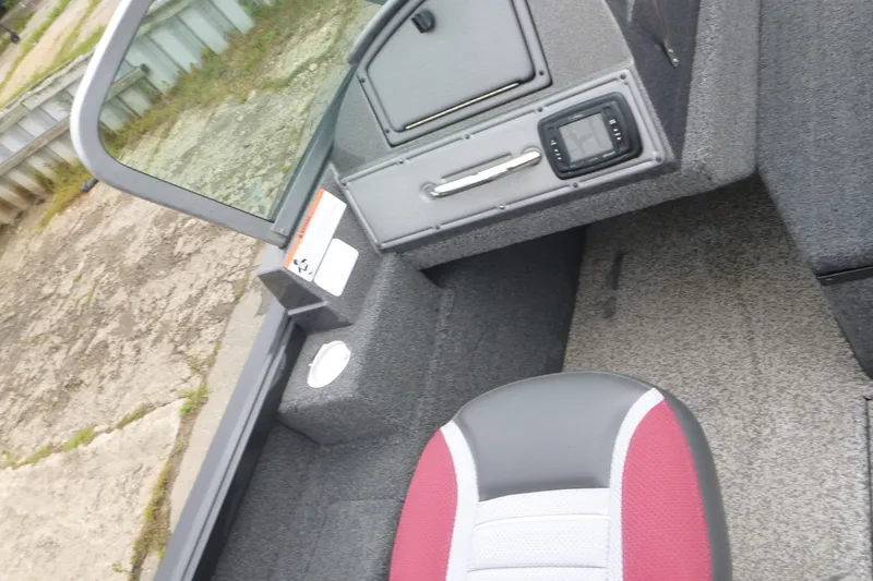 Slide: The Image of 2020 Ranger VS1682 WT boat interior with red and gray seating, dashboard, and controls. - 12