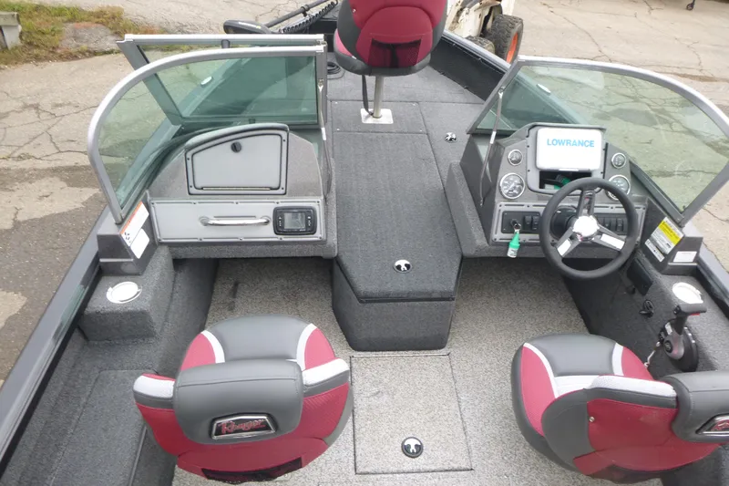 Slide: The Image of 2020 Ranger VS1682 WT boat interior with steering wheel, seats, and Lowrance display. - 5
