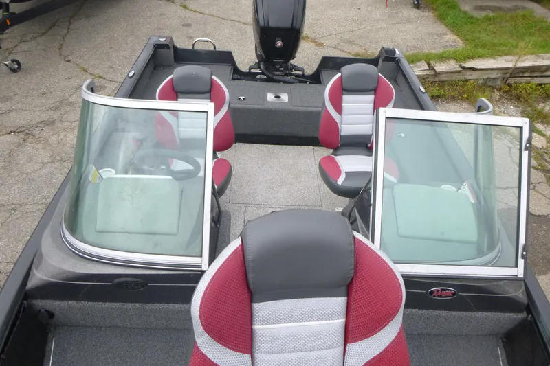 Slide: The Image of 2020 Ranger VS1682 WT boat interior with red and gray seating, dual windshields, and steering wheel. - 6