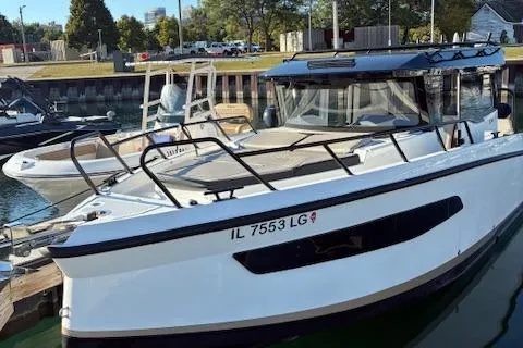 Slide: The Image of 2025 Navan C30 boat docked at a marina, featuring sleek design and modern amenities. - 19