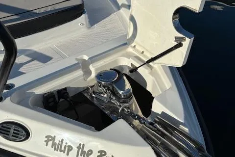 Slide: The Image of 2025 Navan C30 boat with open anchor compartment, docked on water. - 36