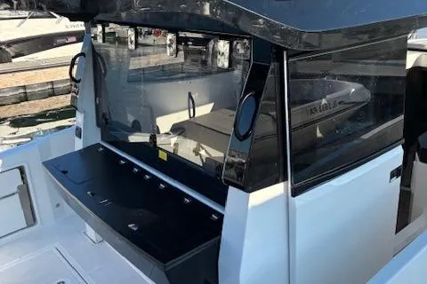 Slide: The Image of 2025 Navan C30 boat with sleek design docked at marina. - 5