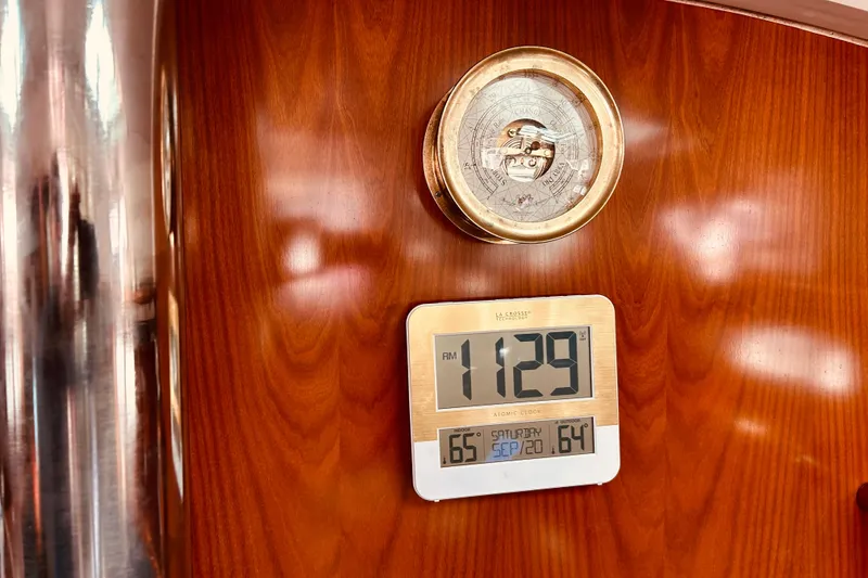 Slide: The Image of Digital clock and barometer on Beneteau 411 yacht's wooden interior, 2001 model. - 15