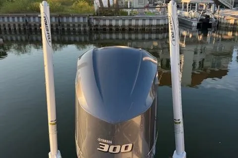 Slide: The Image of 2018 Sea Hunt BX 25 FS with Yamaha 300 engine and Power-Pole anchors on calm water. - 18