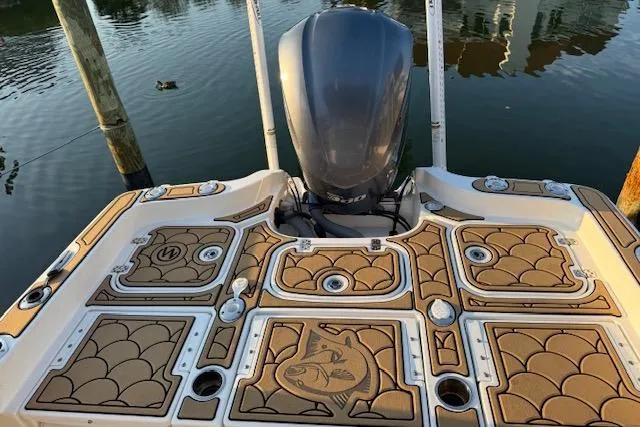 Slide: The Image of 2018 Sea Hunt BX 25 FS boat with detailed deck design and outboard motor. - 2