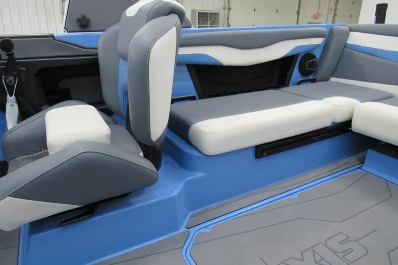 Slide: The Image of 2024 Axis T220 boat interior with blue and gray seating, showcasing modern design. - 5