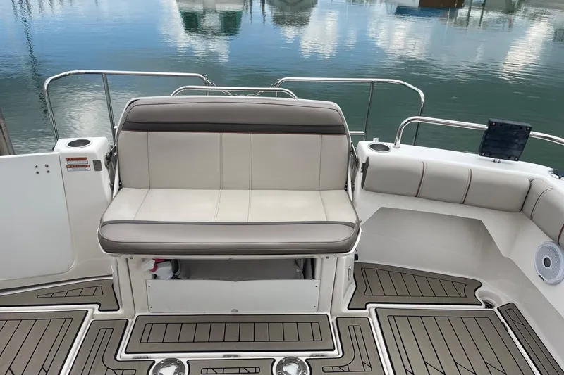 Slide: The Image of 2022 Cutwater C-30 Sedan boat interior with cushioned seating and sleek deck design. - 17