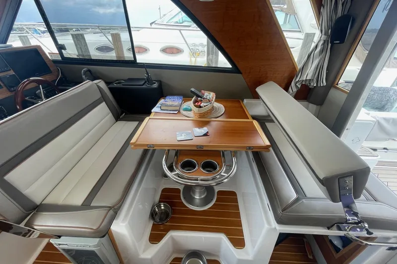 Slide: The Image of Interior of 2022 Cutwater C-30 Sedan with seating and table setup. - 30