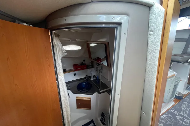 Slide: The Image of 2022 Cutwater C-30 Sedan interior bathroom with modern sink and mirror. - 43