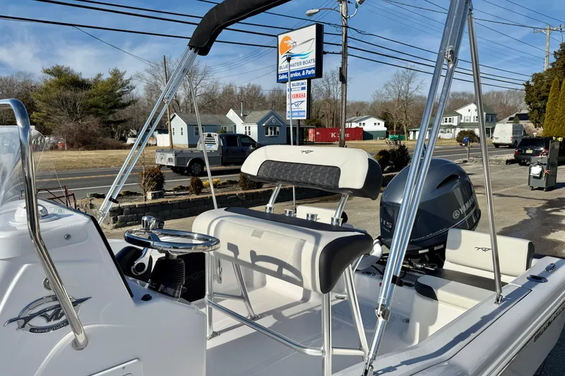 Slide: The Image of 2026 Tidewater 180 CC Adventure boat with Yamaha engine, parked outdoors near dealership. - 24