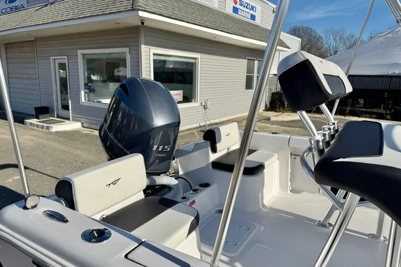 Slide: The Image of 2026 Tidewater 180 CC Adventure boat with Yamaha 115 engine at a marine dealership. - 28