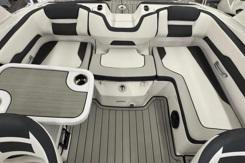 Slide: The Image of 2026 Yamaha Boats 195S interior with sleek seating and modern table design. - 11