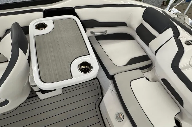 Slide: The Image of 2026 Yamaha Boats 195S interior with sleek seating and modern table design. - 15