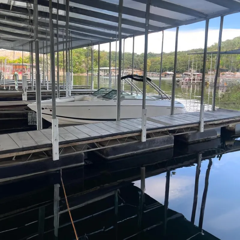 The Image of 2006 Cobalt 272 boat on trailer, white exterior, parked outdoors. - 0