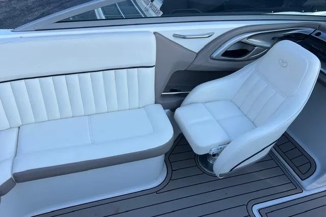 Slide: The Image of 2006 Cobalt 272 boat interior with white cushioned seating and teak flooring. - 15