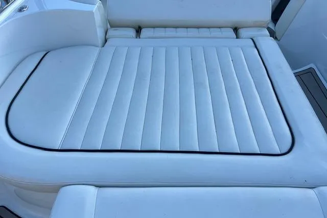 Slide: The Image of 2006 Cobalt 272 boat interior with compact portable toilet in storage compartment. - 17