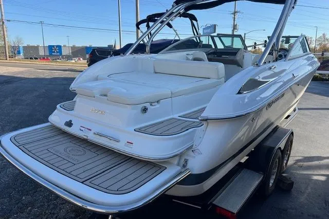 Slide: The Image of 2006 Cobalt 272 boat on trailer, white exterior, rear view, parked outdoors. - 20
