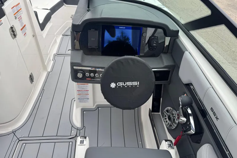 Slide: The Image of 2026 Chaparral 8 SSX boat cockpit with Gussi Italia steering wheel and modern controls. - 10