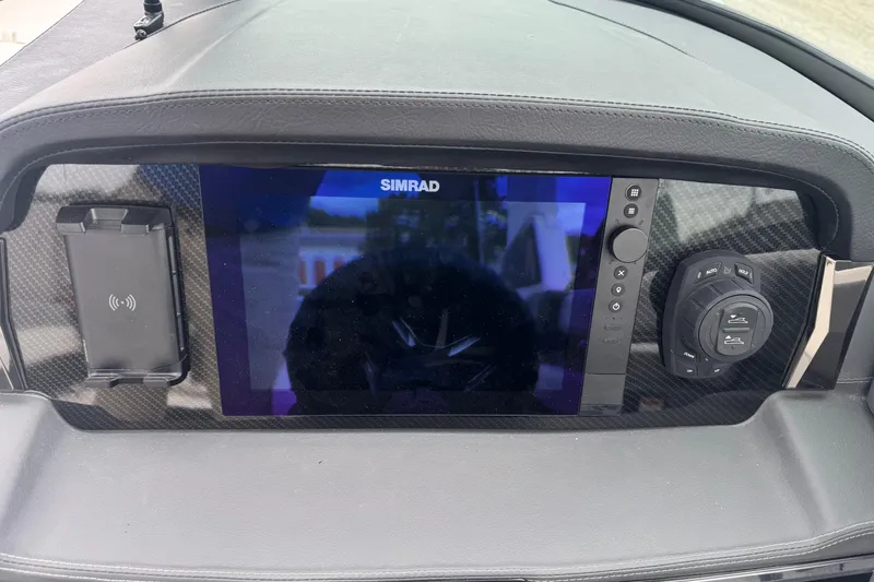 Slide: The Image of Dashboard of 2026 Chaparral 8 SSX with Simrad display and controls. - 15